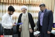 اهدای هدیه رهبر انقلاب به قهرمان پاورلیفتینگ