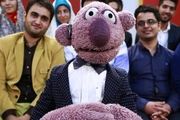 عروسک جناب خان در کیف بازیکن ملی پوش